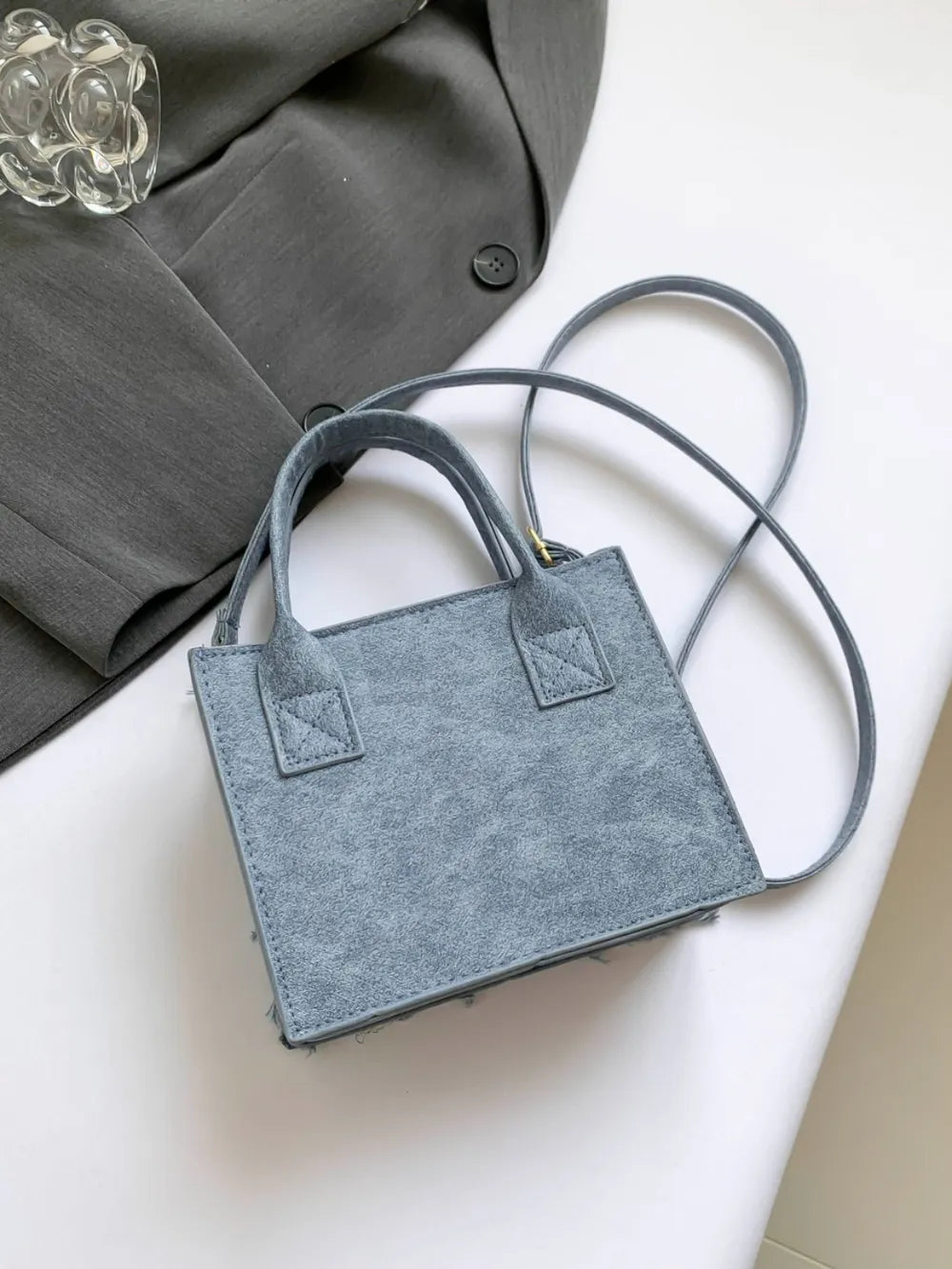 Sac bandoulière à carreaux à bords francs