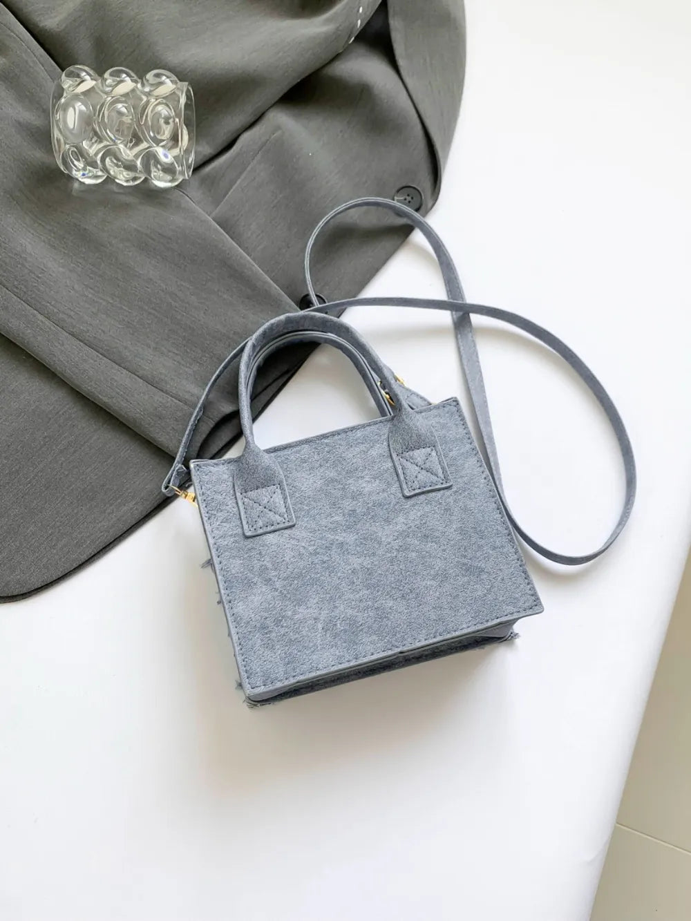 Sac bandoulière à carreaux à bords francs
